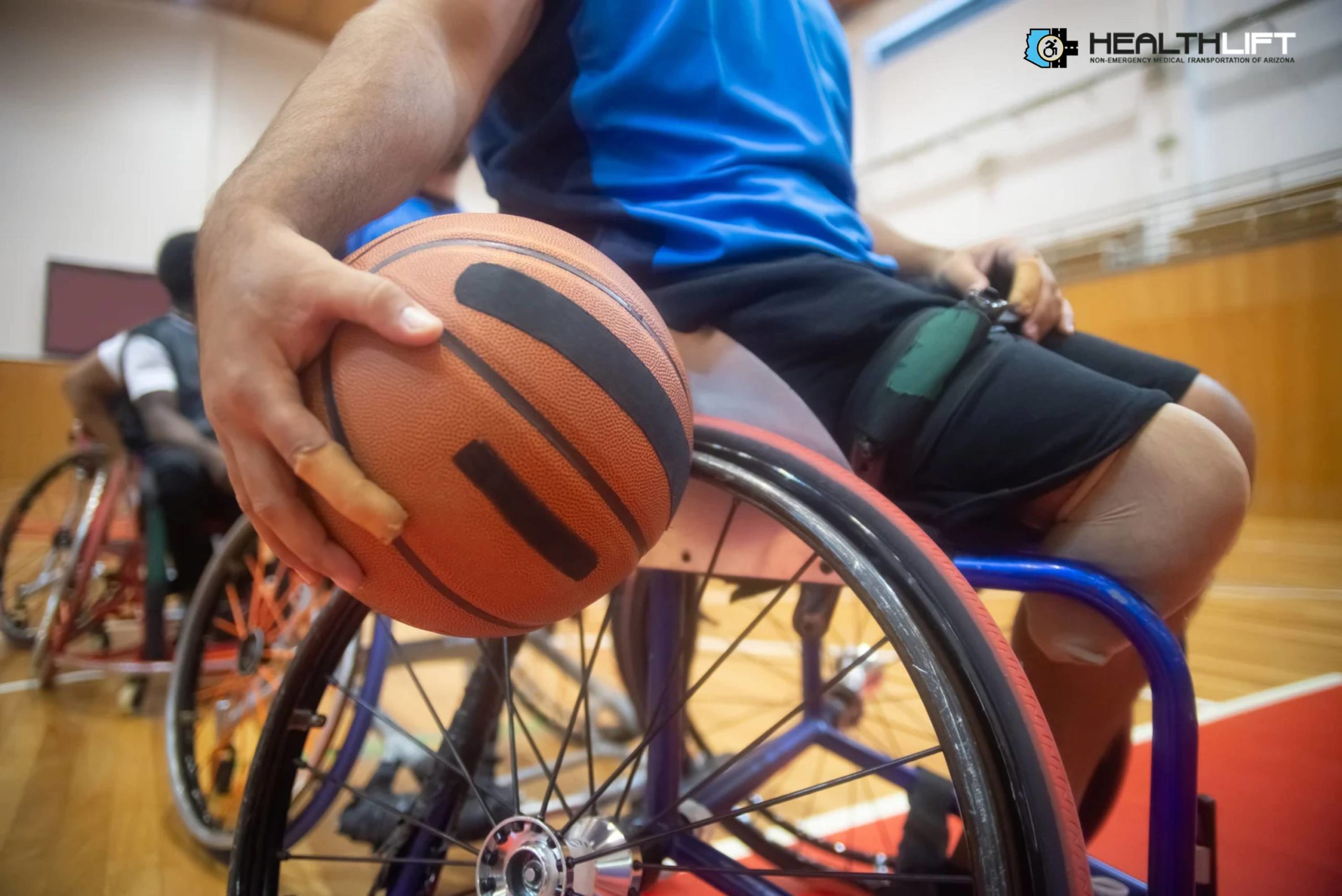 Close-up of Person Sitting on Wheelchair and Holding a Ball