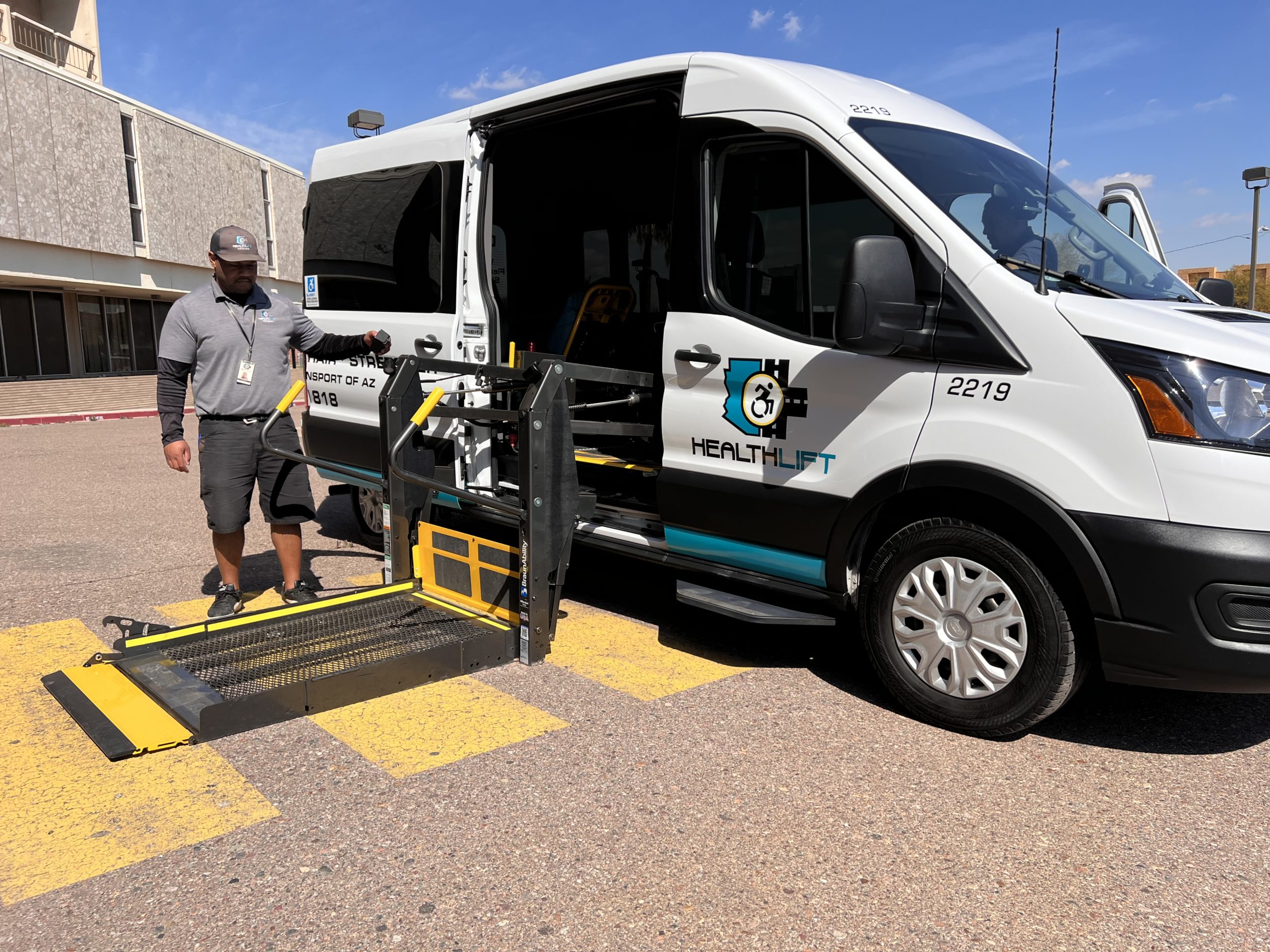 HealthLift Wheelchair Van With Driver Operating Lift