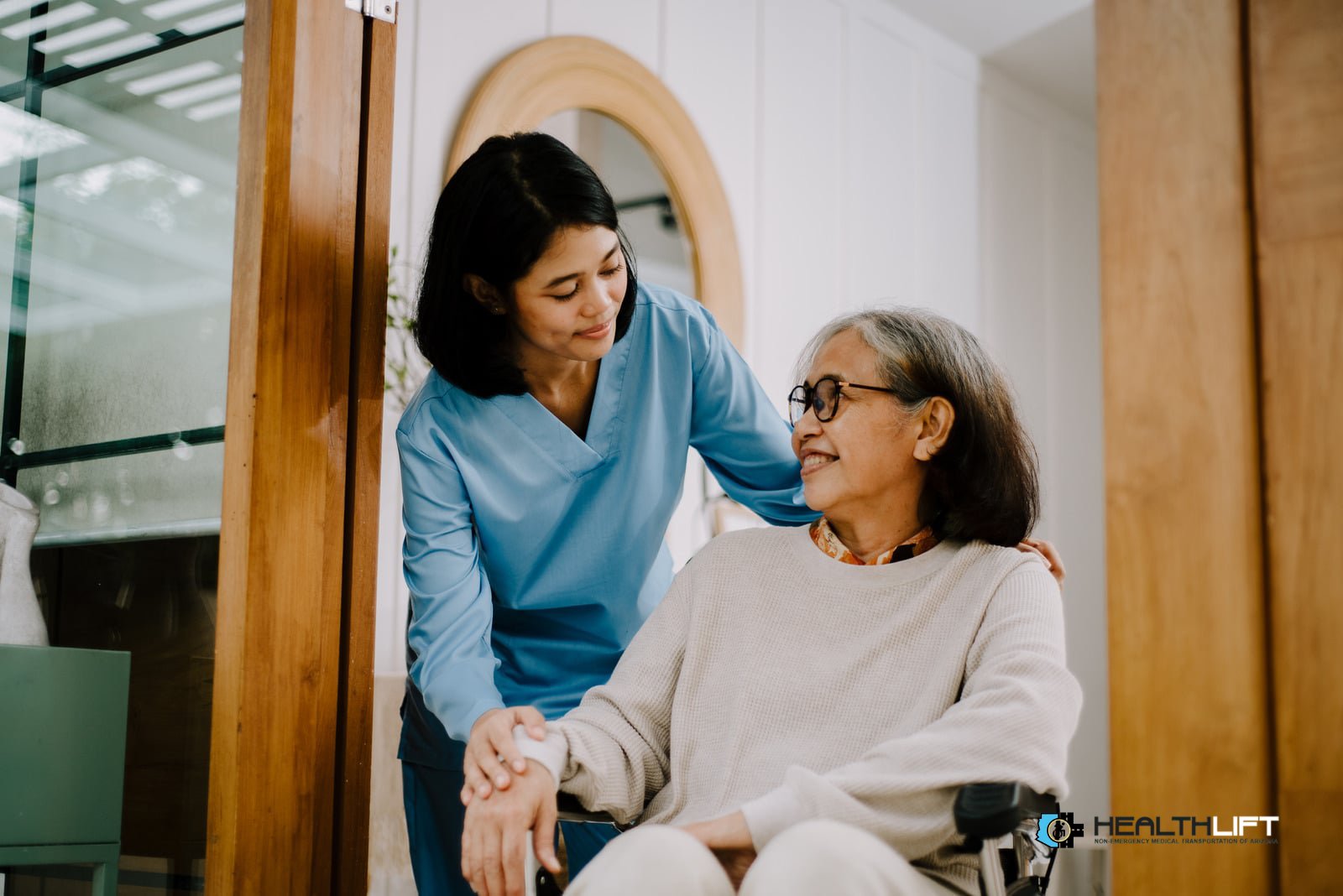 caregiver-comforting-senior-patient-wheelchair Caregiver Comforting Senior Patient in Wheelchair