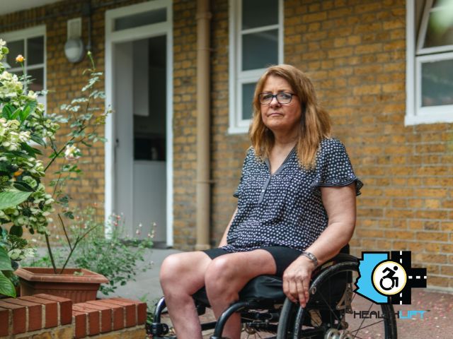 woman-wheelchair-outside-home Woman in Wheelchair Outside Her Home